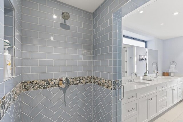5067 Shore Dr, Carlsbad, CA 92008 - full bathroom featuring a tile shower, double vanity, and recessed lighting