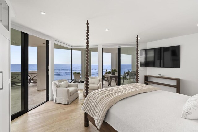 5067 Shore Dr, Carlsbad, CA 92008 - bedroom with floor to ceiling windows, light wood-style flooring, access to outside, and a water view