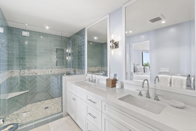 5067 Shore Dr, Carlsbad, CA 92008 - bathroom featuring double vanity, ensuite bath, a stall shower, recessed lighting, and tile patterned floors