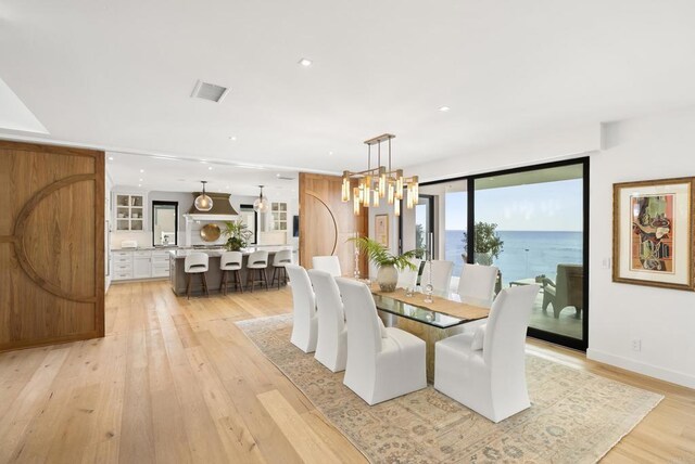 5067 Shore Dr, Carlsbad, CA 92008 - dining space featuring light wood-style floors, a chandelier, and recessed lighting