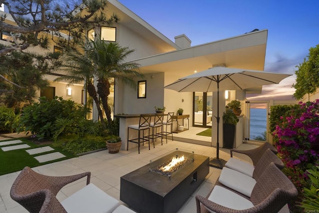 5067 Shore Dr, Carlsbad, CA 92008 - view of patio / terrace with an outdoor living space with a fire pit