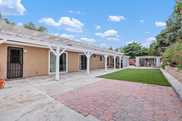 1093 Rancho Santa Fe Rd, Encinitas, CA 92024 - back of property featuring a pergola, stucco siding, a patio area, and a yard