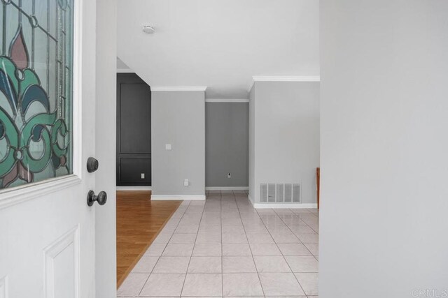 1093 Rancho Santa Fe Rd, Encinitas, CA 92024 - entrance foyer featuring crown molding, baseboards, and light wood-style flooring