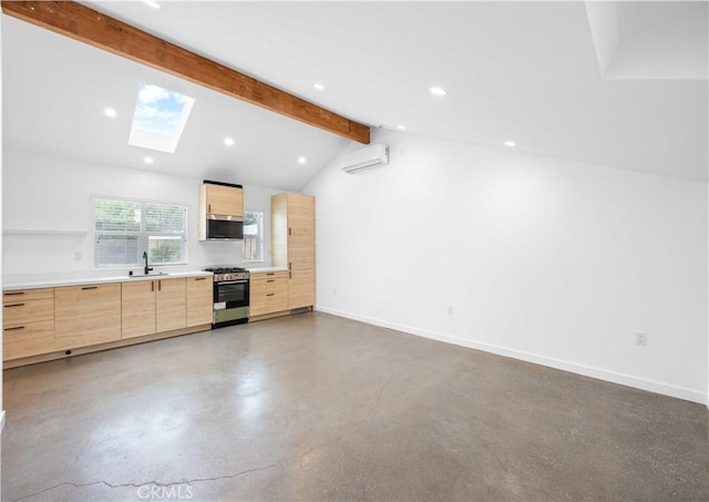 17435 Lassen St, Northridge, CA 91325 - kitchen with stainless steel appliances, light brown cabinetry, a skylight, a wall unit AC, and modern cabinets