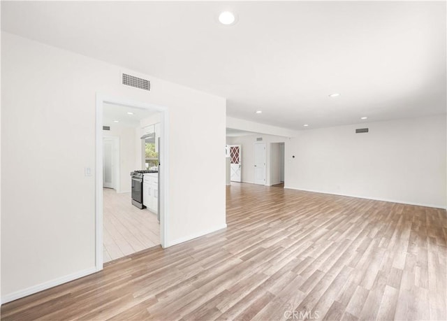 17435 Lassen St, Northridge, CA 91325 - unfurnished living room with recessed lighting, light wood-style flooring, and baseboards