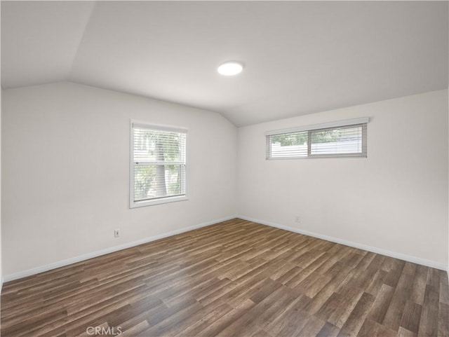 17435 Lassen St, Northridge, CA 91325 - empty room with lofted ceiling, dark wood finished floors, and baseboards