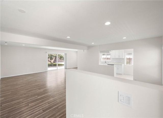 17435 Lassen St, Northridge, CA 91325 - unfurnished living room with recessed lighting, wood finished floors, and baseboards