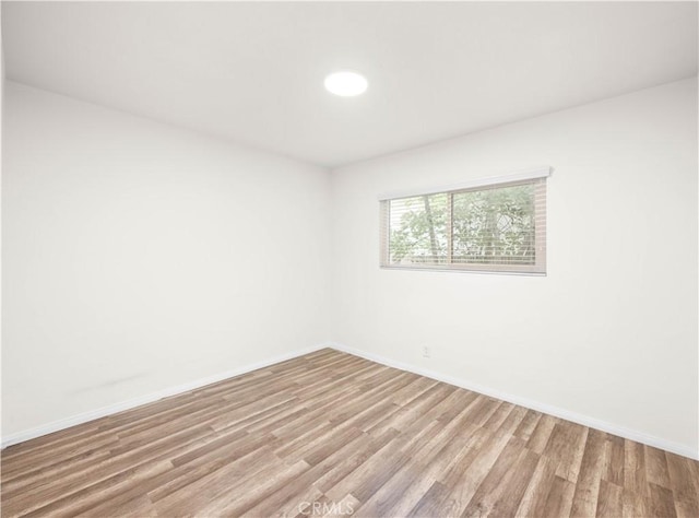 17435 Lassen St, Northridge, CA 91325 - unfurnished room with light wood-style flooring and baseboards