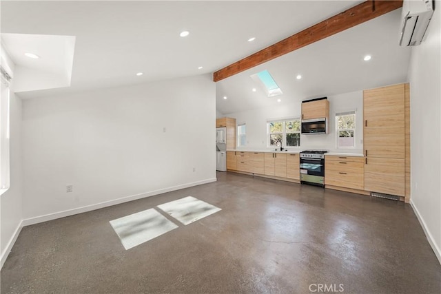 17435 Lassen St, Northridge, CA 91325 - unfurnished living room featuring a wall unit AC, baseboards, recessed lighting, finished concrete flooring, and a skylight