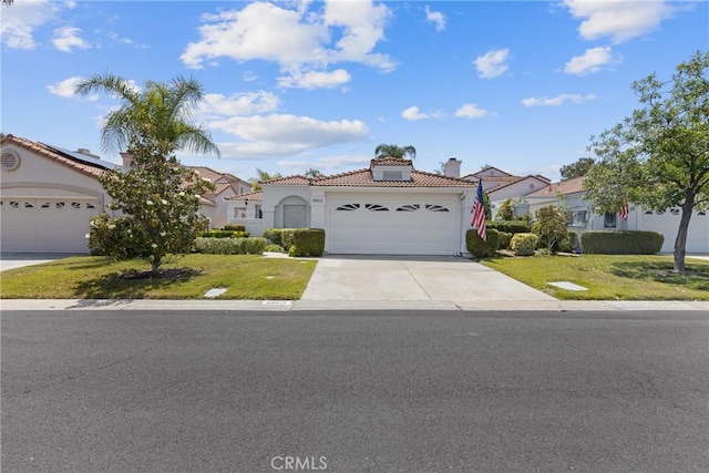 40612 Via Amapola, Murrieta, CA 92562 - mediterranean / spanish-style house featuring a tiled roof, driveway, a garage, stucco siding, and a front yard
