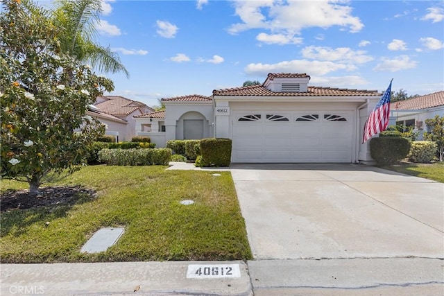 40612 Via Amapola, Murrieta, CA 92562 - mediterranean / spanish home featuring a tile roof, a front lawn, stucco siding, and concrete driveway