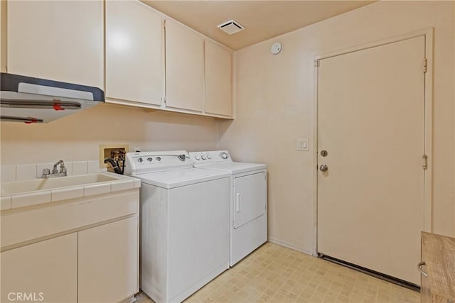 40612 Via Amapola, Murrieta, CA 92562 - laundry area featuring washer and clothes dryer, cabinet space, light floors, and baseboards