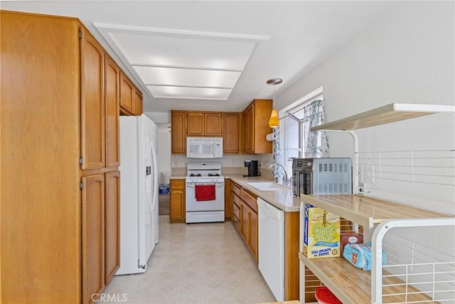 40612 Via Amapola, Murrieta, CA 92562 - kitchen with white appliances, brown cabinets, a sink, and light countertops