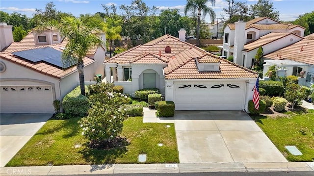 40612 Via Amapola, Murrieta, CA 92562 - mediterranean / spanish-style house featuring driveway, a tile roof, an attached garage, and stucco siding