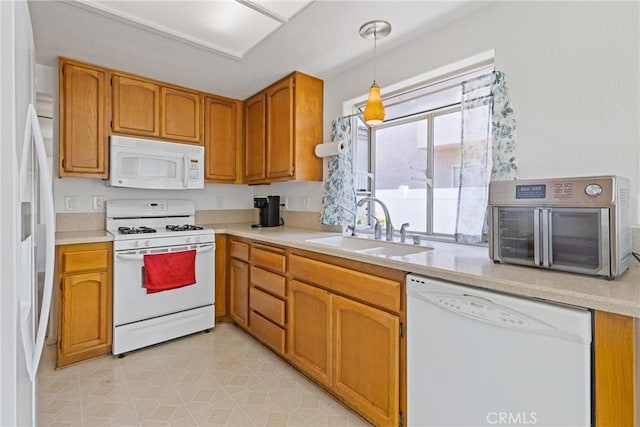 40612 Via Amapola, Murrieta, CA 92562 - kitchen featuring white appliances, a sink, light countertops, and hanging light fixtures