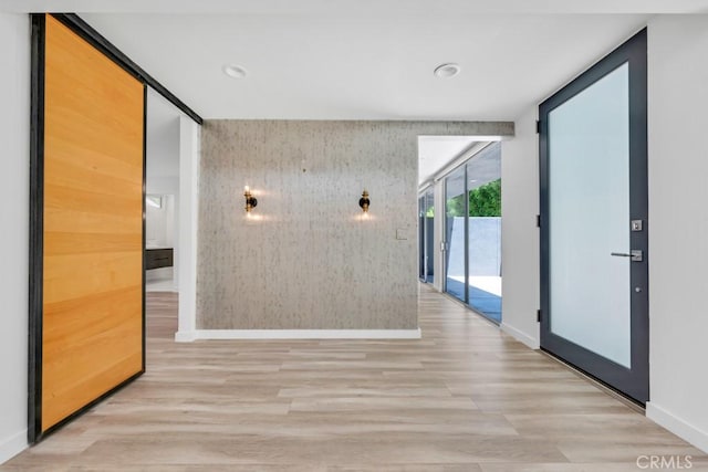 11230 Dilling St, Studio City, CA 91602 - hallway featuring baseboards, wood finished floors, expansive windows, recessed lighting, and an accent wall