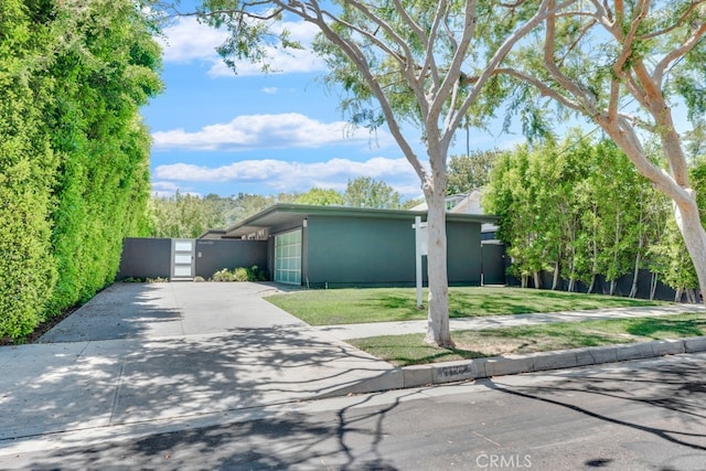 11230 Dilling St, Studio City, CA 91602 - mid-century home with concrete driveway, a front yard, stucco siding, and a gate