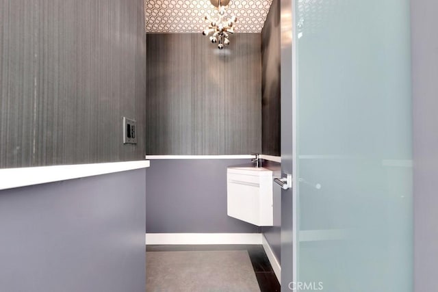 11230 Dilling St, Studio City, CA 91602 - bathroom featuring baseboards and a chandelier