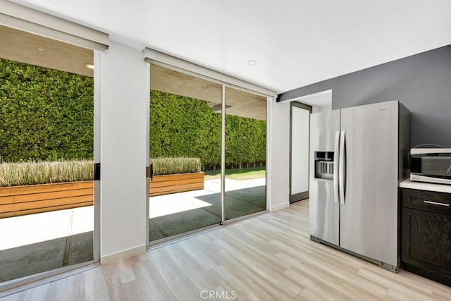 11230 Dilling St, Studio City, CA 91602 - kitchen with appliances with stainless steel finishes, light wood finished floors, and plenty of natural light