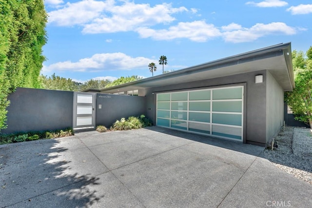 11230 Dilling St, Studio City, CA 91602 - view of front of property with concrete driveway, stucco siding, a gate, and an attached garage