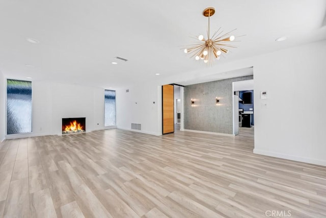 11230 Dilling St, Studio City, CA 91602 - unfurnished living room featuring a warm lit fireplace, a chandelier, light wood-style flooring, baseboards, and recessed lighting