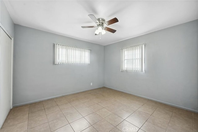 820 Carlotta Ct, Redlands, CA 92374 - spare room featuring a ceiling fan, light tile patterned floors, and baseboards