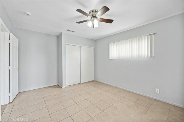 820 Carlotta Ct, Redlands, CA 92374 - unfurnished bedroom featuring a closet, baseboards, and ceiling fan