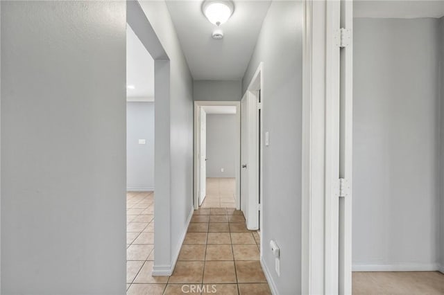 820 Carlotta Ct, Redlands, CA 92374 - corridor with light tile patterned flooring and baseboards