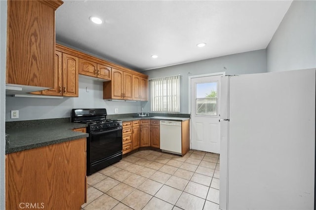 820 Carlotta Ct, Redlands, CA 92374 - kitchen featuring white appliances, a sink, dark countertops, light tile patterned floors, and recessed lighting