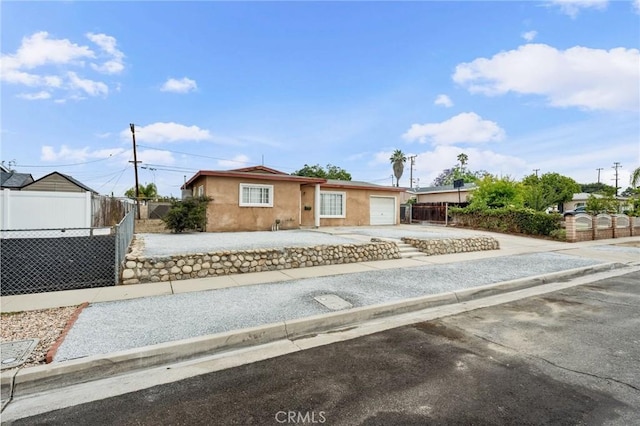 820 Carlotta Ct, Redlands, CA 92374 - ranch-style home with stucco siding, a garage, and driveway