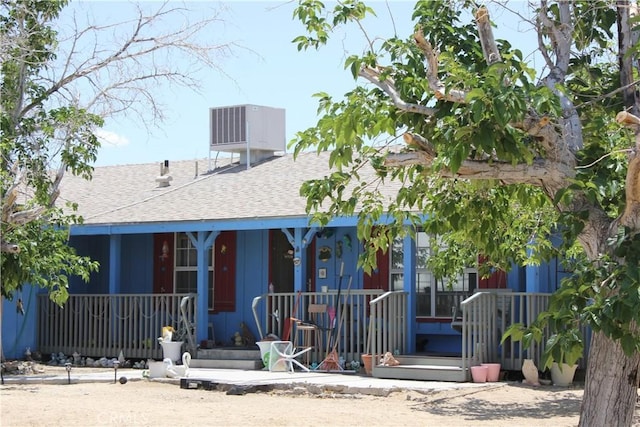 7117 Bonita Ave, Joshua Tree, CA 92252 - view of front facade with a shingled roof and a porch