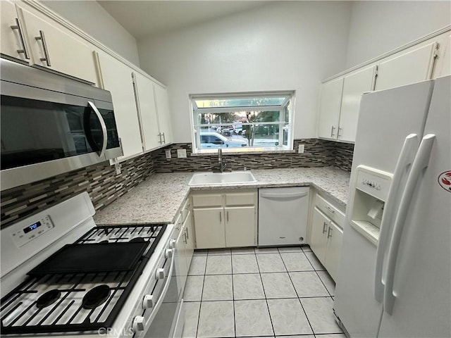 618 Award Dr, Colton, CA 92324 - kitchen with white appliances, a sink, backsplash, light tile patterned flooring, and white cabinets