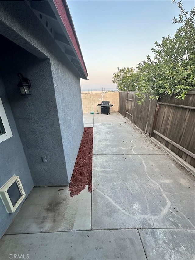 618 Award Dr, Colton, CA 92324 - patio terrace at dusk featuring a fenced backyard and a patio