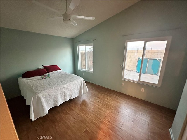 618 Award Dr, Colton, CA 92324 - bedroom featuring wood finished floors, vaulted ceiling, and a ceiling fan