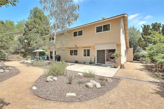 349 N Del Sol Ln, Diamond Bar, CA 91765 - rear view of house featuring stucco siding and a patio area