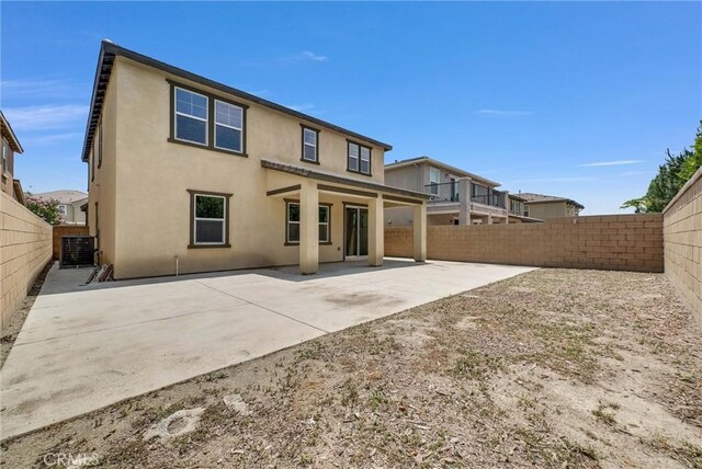 4742 S Scott Way, Ontario, CA 91762 - back of house with a fenced backyard, stucco siding, and a patio area