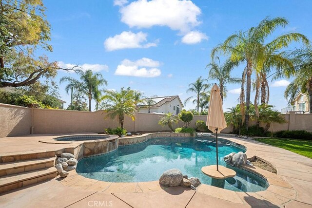 30667 Shore Ridge Dr, Menifee, CA 92584 - view of swimming pool featuring a fenced backyard, a patio, and a pool with connected hot tub