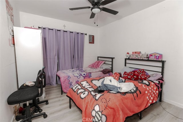 1222 W Kettering St, Lancaster, CA 93534 - bedroom with wood finished floors and a ceiling fan