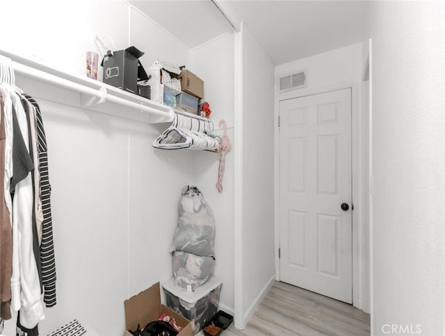 1222 W Kettering St, Lancaster, CA 93534 - walk in closet featuring light wood-type flooring