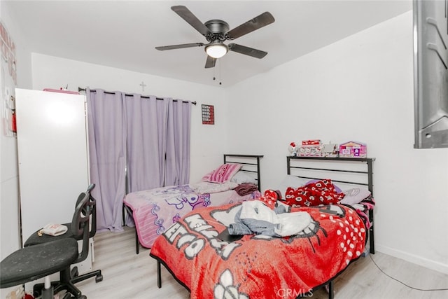 1222 W Kettering St, Lancaster, CA 93534 - bedroom with light wood-style flooring and a ceiling fan