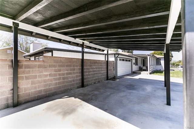 1222 W Kettering St, Lancaster, CA 93534 - view of patio featuring a garage and driveway
