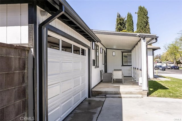 1222 W Kettering St, Lancaster, CA 93534 - garage with driveway and covered porch