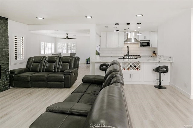 1222 W Kettering St, Lancaster, CA 93534 - living area featuring a ceiling fan, light wood-type flooring, and recessed lighting