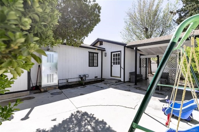 1222 W Kettering St, Lancaster, CA 93534 - rear view of house featuring a patio
