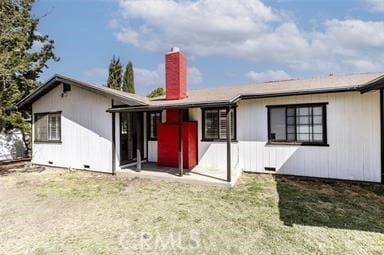 1222 W Kettering St, Lancaster, CA 93534 - back of house with a chimney