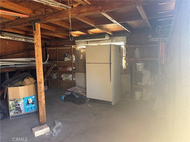 1222 W Kettering St, Lancaster, CA 93534 - basement featuring freestanding refrigerator and a garage