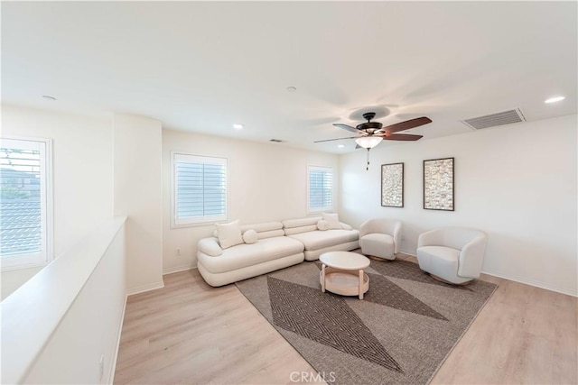 6940 Lagoon Ct, Jurupa Valley, CA 91752 - living room with light wood-style flooring, ceiling fan, and recessed lighting