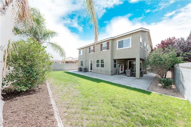 6940 Lagoon Ct, Jurupa Valley, CA 91752 - back of property with stucco siding, a fenced backyard, and a patio