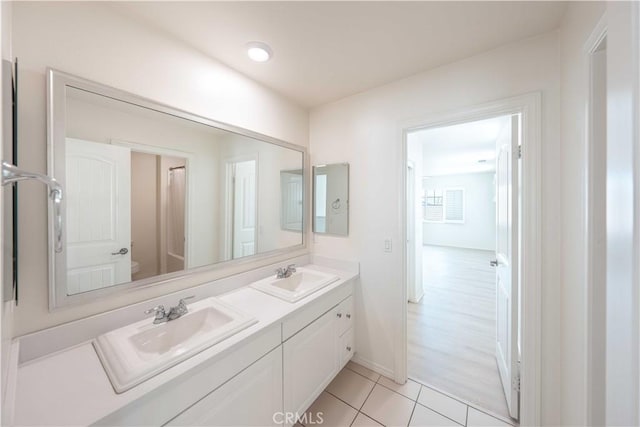 6940 Lagoon Ct, Jurupa Valley, CA 91752 - bathroom with double vanity and tile patterned floors