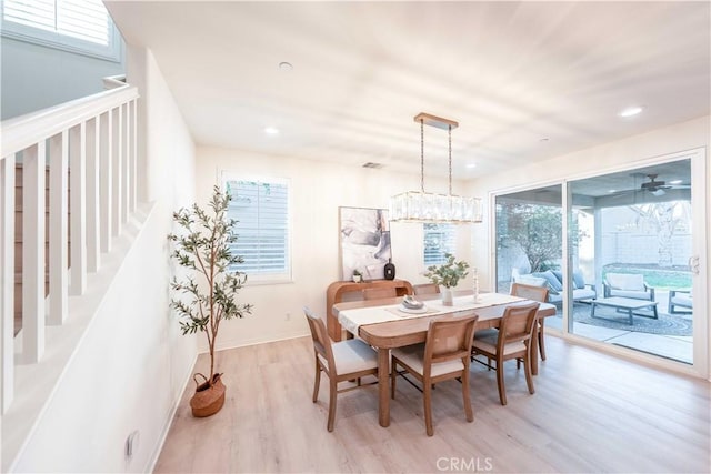 6940 Lagoon Ct, Jurupa Valley, CA 91752 - dining space featuring light wood finished floors, recessed lighting, and stairway